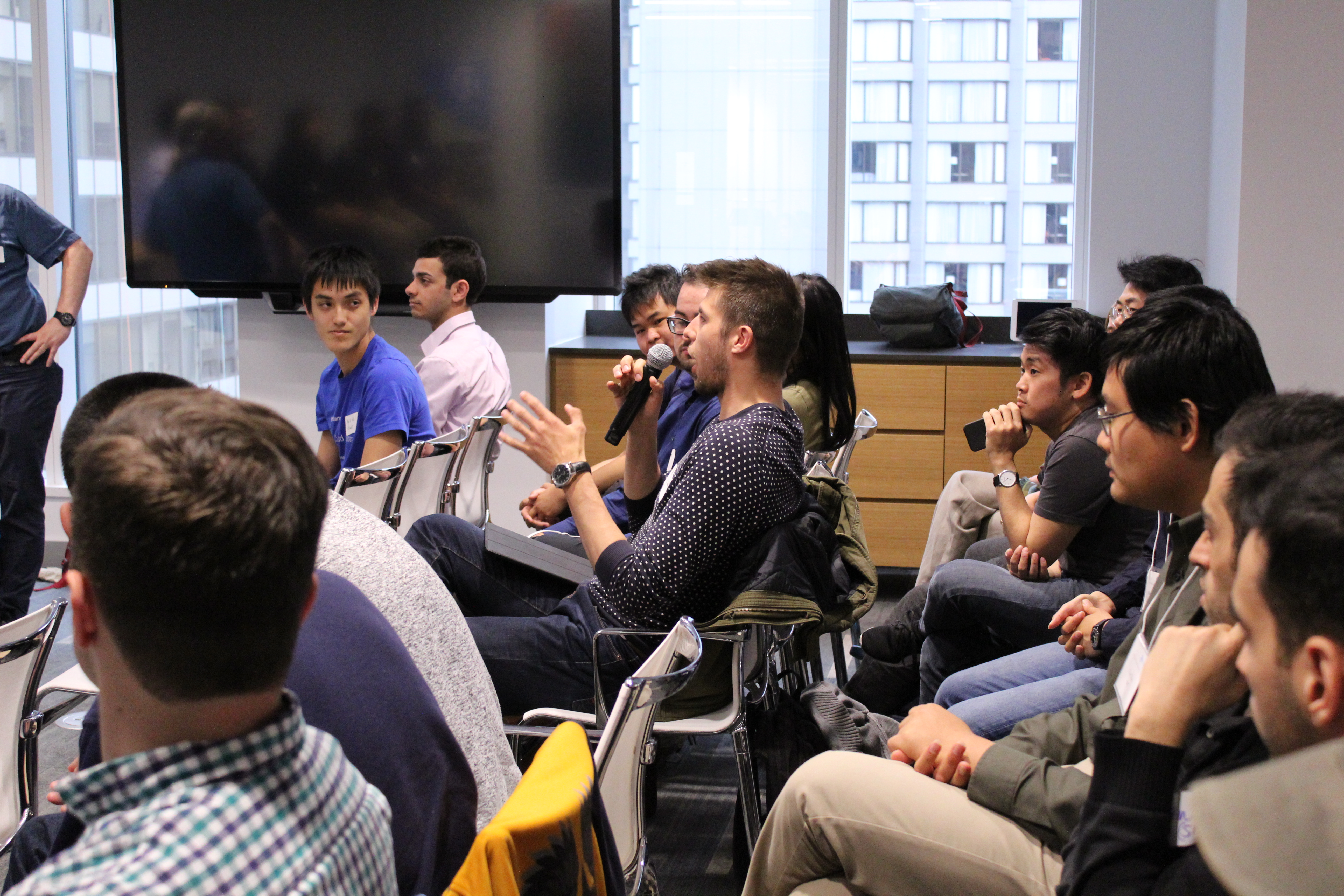 Participant asking a question during the Q&A session. Photo credit: Miguel Eichelberger (PIMS).